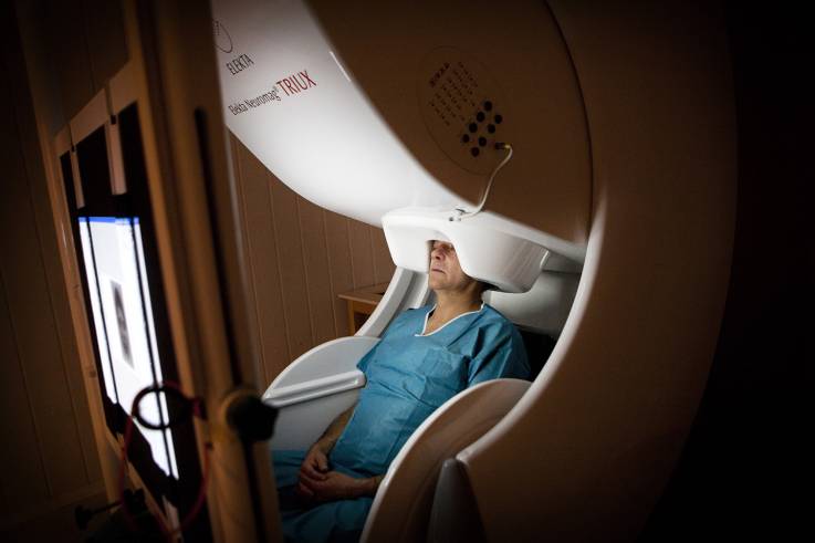 A machine measures variations in the brain’s magnetic field.jpg