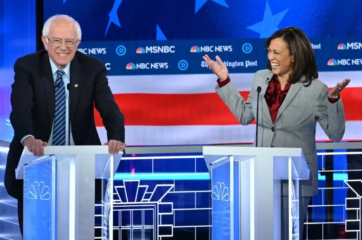 Democratic presidential hopefuls Former Vice President Joe Biden and California Senator Kamala Harris share a laugh during the fifth Democratic primary debate of the 2020 presidential campaign season co-hosted by.jpg